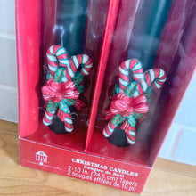 Load image into Gallery viewer, Sweet pair of green Christmas taper candles with figural red/white/green candy canes and bows. A great way to add a warm glow to your holiday decor!  Measures 10 inches. New in box.
