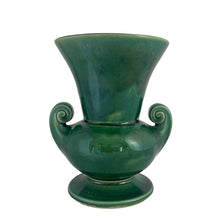 Load image into Gallery viewer, Vintage mid-century gloss green trumpet vase with curled handles. Crafted by McCoy Pottery, late 1950s. This lovely vase is must for any art pottery collector!

In excellent&nbsp; condition, no chips/cracks/repairs, crazing commensurate with age, typical manufacturing glaze pops. Maker&#39;s mark on the bottom.

Measures 6 1/4 x 5 7/8 x 8 inches
