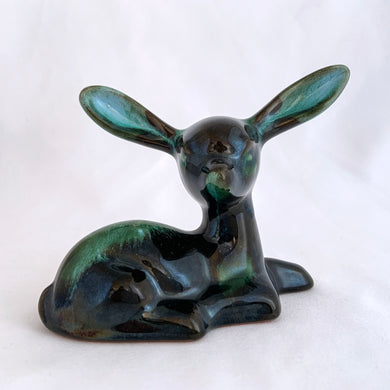 A really sweet green drip glaze seated deer figurine. Crafted by the king of redware, Blue Mountain Pottery, Canada, circa 1960/70s. A lovely piece to begin or add to your art pottery collection....just look at those irresistible ears! Made in Canada in the 1960s (see below for a brief history).  In excellent condition, free from chips/cracks/repairs.  4 1/2 x 2 x 3 7/8 inches