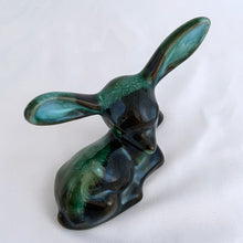 Load image into Gallery viewer, A really sweet green drip glaze seated deer figurine. Crafted by the king of redware, Blue Mountain Pottery, Canada, circa 1960/70s. A lovely piece to begin or add to your art pottery collection....just look at those irresistible ears! Made in Canada in the 1960s (see below for a brief history).  In excellent condition, free from chips/cracks/repairs.  4 1/2 x 2 x 3 7/8 inches
