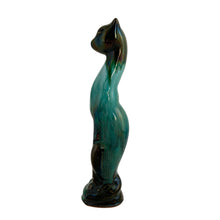 Load image into Gallery viewer, Vintage retro green drip glaze slim standing cat redware pottery figurine, featuring open eyes. Crafted by Canadian Ceramic Craft (CCC), Canada, circa 1960s. Add this very cool cat to your collection. For an extra spooky look, put a tiny light inside to make the eyes glow! In excellent condition, free form chips/cracks/repairs. Measures 1 1/2 x 2 x 8 inches
