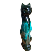 Load image into Gallery viewer, Large vintage retro green drip glaze cat redware pottery figurine or TV lamp, featuring open eyes and hole at the tale for a lighting cord or incense. Crafted by Canadian Ceramic Craft (CCC), Canada, circa 1960s. Add this very cool cat to your collection. For an extra spooky look for your Halloween decor, put a tiny light inside to make the eyes glow!

In excellent condition, no chips/cracks/repairs.

Measures 5 5/8 x 3 3/8 x 17 1/2 inches

