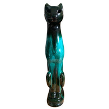 Load image into Gallery viewer, Large vintage retro green drip glaze cat redware pottery figurine or TV lamp, featuring open eyes and hole at the tale for a lighting cord or incense. Crafted by Canadian Ceramic Craft (CCC), Canada, circa 1960s. Add this very cool cat to your collection. For an extra spooky look for your Halloween decor, put a tiny light inside to make the eyes glow!

In excellent condition, no chips/cracks/repairs.

Measures 5 5/8 x 3 3/8 x 17 1/2 inches
