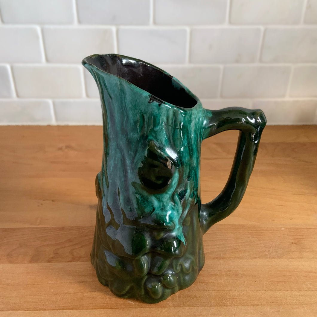 Vintage green drip glaze pitcher, featuring a woodland design of raised mushrooms and knots around a tree trunk. Crafted by Evangeline Pottery, Canada, 1960s. This sweet pitcher makes for a beautiful statement piece or a functional pitcher for your home.

In excellent condition, no chips/cracks/repairs.

Measures 5 x 3 5/8 x 6 1/4 inches