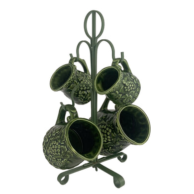 Vintage set of four dark green glazed ceramic measuring cups which hang on a green metal stand. Crafted by Noritake, Japan, 1960s. The cups feature an embossed grapevine pattern with flower borders. Each cup is marked, 1 cup, 1/2 cup, 1/4 cup and 1/8 cup. A sweet and practical piece of kitchen decor!  Overall good vintage condition. The 1/2 cup has a glaze chip on the rim and the 1/4 cup measure has a tiny flea bite on the handle, see photos.