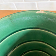 Load image into Gallery viewer, Striking vintage gloss green basketweave planter pot with attached saucer. Crafted by McCoy Pottery, 1953. This rare planter is must for any McCoy art pottery collector!

In as found vintage condition, chipped, two tight hairline cracks, hard water residue. Maker&#39;s mark on the bottom.

Measures 6 1/4 x 5 1/2 inches
