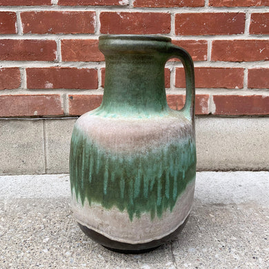 Vintage green gray fat lava glaze handled floor vase, deep brown ground. Shape 0326-40. Crafted by Carstens Tönnieshof, West Germany, 1970s. A wonderful collector piece of mid-century era art pottery to enhance your home's decor.

In excellent vintage condition. no chips/cracks/repairs.

Measures 10 1/4 x 16 1/8 inches