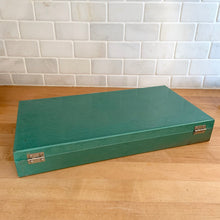 Load image into Gallery viewer, Vintage green metal storage box featuring slots for up to 150 photographic slide transparencies and handle. This is the perfect way to maintain the integrity of your family&#39;s vintage memories!  In good used vintage condition, scuffing commensurate with age. Hinges intact and lock mechanism in working condition.  Measures 14 1/2 x 7 5/8 x 2 1/8 inches   
