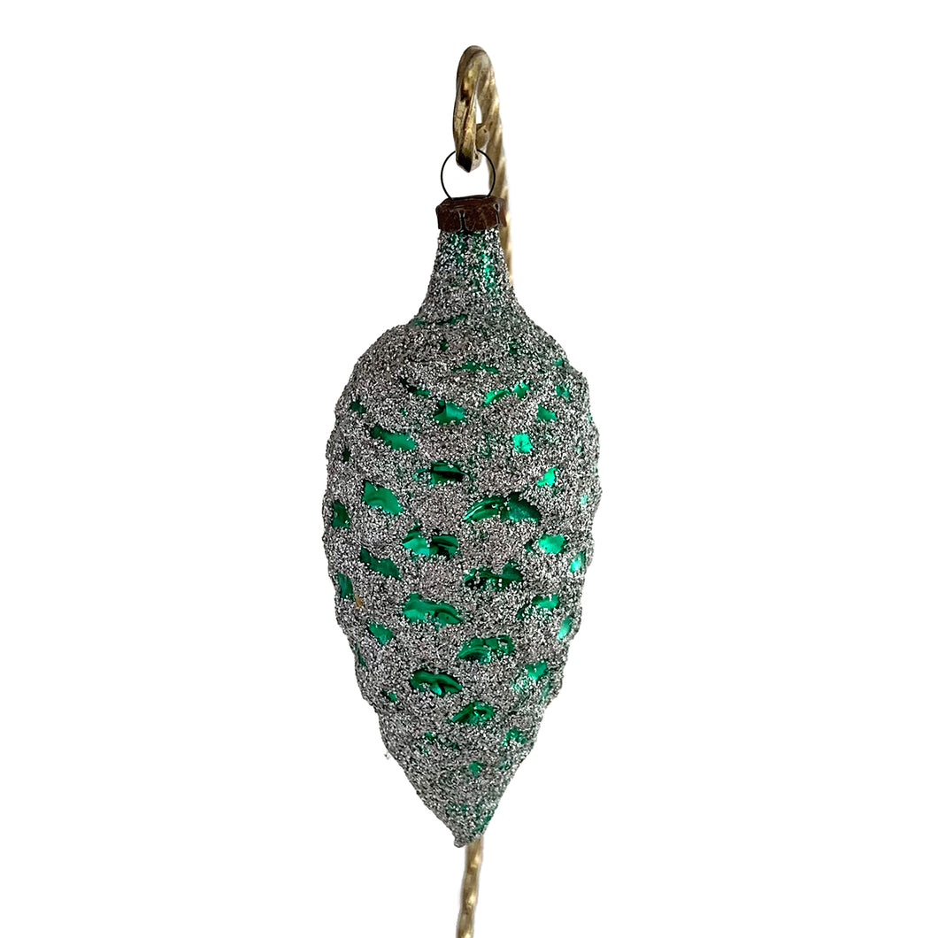 Vintage hand blown green pine cone mercury glass Christmas tree ornament decorated with silver glitter.

In excellent condition. Marked, GDR (Germany).

Measures 3 1/2 inches

Holiday Decor Toronto