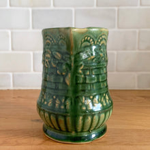 Load image into Gallery viewer, Antique vintage art deco gloss green Rosella no. 320 ceramic yellow ware pitcher featuring climbing roses on a basketweave pattern. Crafted by Robinson Clay Product Company, the precursor to Robinson Ransbottom Pottery, USA, early 1900s. A beautiful piece to add to your art pottery collection!

In excellent vintage condition, no chips/cracks/repairs, typical age-related crazing and manufacturer&#39;s glaze pops. Unmarked.

Measurements 5 1/4 x 5 inches (incl. spout/handle)
