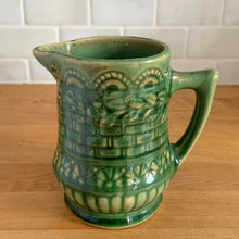 Load image into Gallery viewer, Antique vintage art deco gloss green Rosella no. 320 ceramic yellow ware pitcher featuring climbing roses on a basketweave pattern. Crafted by Robinson Clay Product Company, the precursor to Robinson Ransbottom Pottery, USA, early 1900s. A beautiful piece to add to your art pottery collection!

In excellent vintage condition, no chips/cracks/repairs, typical age-related crazing and manufacturer&#39;s glaze pops. Unmarked.

Measurements 5 1/4 x 5 inches (incl. spout/handle)

