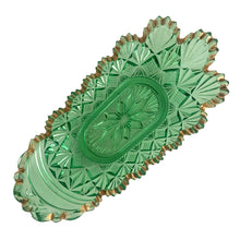 Load image into Gallery viewer, Overhead view of McKee Teutonic green pressed glass pickle dish showing interior and full oval form

