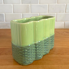 Load image into Gallery viewer, Vintage mid-century two-tone green basketweave art pottery planter. Crafted by McCoy Pottery, USA, circa 1950s. A collectible art pottery planter that is perfect for forcing spring flower bulbs, planting succulent or a floral arrangement.

In excellent condition, no chips/cracks/repairs. Maker&#39;s mark.

Measures 5 5/8 x 2 1/2 x 4 1/4 inches
