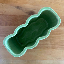 Load image into Gallery viewer, Vintage mid-century two-tone green basketweave art pottery planter. Crafted by McCoy Pottery, USA, circa 1950s. A collectible art pottery planter that is perfect for forcing spring flower bulbs, planting succulent or a floral arrangement.

In excellent condition, no chips/cracks/repairs. Maker&#39;s mark.

Measures 5 5/8 x 2 1/2 x 4 1/4 inches
