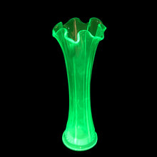 Load image into Gallery viewer, Vintage uranium art glass swung flower vase with a lovely ruffled rim. Crafted by Fenton Art Glass, USA, 1930s. Glows brilliantly when exposed to black light. Perfect for the swung, uranium or Fenton glass collector!

In very good vintage condition, no chips, cracks, or repairs, hard water marks consistent with age.

Measures 3 3/4 x 9 5/8 inches
