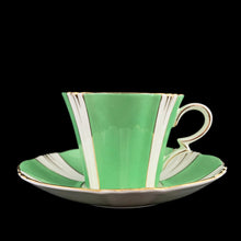 Load image into Gallery viewer, This antique art deco style white bone china teacup and saucer is simply elegant! Both the cup and saucer have a lovely square scalloped edge, hand painted in green colour blocks alternating with white along with gold gilt details and rim. Crafted by Royal Albert Crown China, England, between 1925 to 1927. A beautiful old piece that has stood the test of time!
