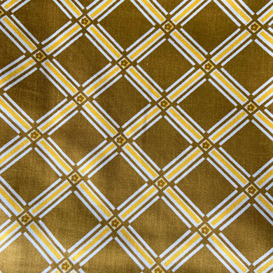 Vintage geometric tartan patterned fabric remnant with flower detail in olive green and yellow and white. Crafted by 5th Avenue Design, USA. Label states Copyright - USA 5th Avenue Design Inc. Vat Dyes - preshrunk Permanent Schreinered Protected With COVGARD - Screen Printed. Perfect for home decor crafting!

In excellent condition, no stains/tears.

Measures 24 1/2 x 108 inches / 3 yards