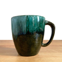 Load image into Gallery viewer, This fabulous vintage green and black drip glazed mug was produced by Blue Mountain Pottery, the pride of Collingwood, Canada, circa 1970. Perfect for your morning cuppa!

Excellent condition, no chips or cracks.

Measures 4 x 4 inches (without handle)
