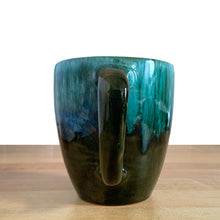 Load image into Gallery viewer, This fabulous vintage green and black drip glazed mug was produced by Blue Mountain Pottery, the pride of Collingwood, Canada, circa 1970. Perfect for your morning cuppa!

Excellent condition, no chips or cracks.

Measures 4 x 4 inches (without handle)
