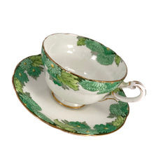 Load image into Gallery viewer, Vintage Chrysanthemum fine bone china teacup and saucer featuring flowers in shades of green and gold gilt trim. Crafted by Paragon, England, 1923-33. A lovely way to enjoy a cuppa tea!

In excellent condition, no chips, cracks or repairs. Maker&#39;s mark on the bottom.

Measures 4 x 2 3/8 inches | Saucer measures 5 1/2 inches
