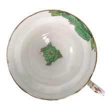 Load image into Gallery viewer, Vintage Chrysanthemum fine bone china teacup and saucer featuring flowers in shades of green and gold gilt trim. Crafted by Paragon, England, 1923-33. A lovely way to enjoy a cuppa tea!

In excellent condition, no chips, cracks or repairs. Maker&#39;s mark on the bottom.

Measures 4 x 2 3/8 inches | Saucer measures 5 1/2 inches
