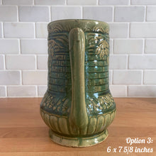 Load image into Gallery viewer, Antique vintage art deco gloss green Rosella 320 ceramic yellow ware pitcher featuring climbing roses on a basketweave pattern. Crafted by Robinson Clay Product Company, the precursor to Robinson Ransbottom Pottery, USA, early 1900s. A beautiful piece to add to your art pottery collection! Option 3: 6 x 7 5/8 inches. In excellent vintage condition, no chips/cracks/repairs, age-related crazing. Typical manufacturing glaze pops. Unmarked.
