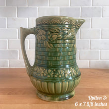 Load image into Gallery viewer, Antique vintage art deco gloss green Rosella 320 ceramic yellow ware pitcher featuring climbing roses on a basketweave pattern. Crafted by Robinson Clay Product Company, the precursor to Robinson Ransbottom Pottery, USA, early 1900s. A beautiful piece to add to your art pottery collection! Option 3: 6 x 7 5/8 inches. In excellent vintage condition, no chips/cracks/repairs, age-related crazing. Typical manufacturing glaze pops. Unmarked.

