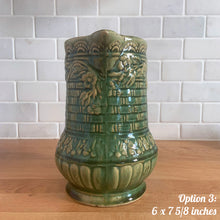 Load image into Gallery viewer, Antique vintage art deco gloss green Rosella 320 ceramic yellow ware pitcher featuring climbing roses on a basketweave pattern. Crafted by Robinson Clay Product Company, the precursor to Robinson Ransbottom Pottery, USA, early 1900s. A beautiful piece to add to your art pottery collection! Option 3: 6 x 7 5/8 inches. In excellent vintage condition, no chips/cracks/repairs, age-related crazing. Typical manufacturing glaze pops. Unmarked.
