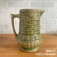 Load image into Gallery viewer, Antique vintage art deco gloss green Rosella 320 ceramic yellow ware pitcher featuring climbing roses on a basketweave pattern. Crafted by Robinson Clay Product Company, the precursor to Robinson Ransbottom Pottery, USA, early 1900s. A beautiful piece to add to your art pottery collection! Option 4, 6 1/2 x 7 1/2 inches
In excellent vintage condition, no chips/cracks/repairs, age-related crazing. Typical manufacturing glaze pops. Unmarked.
