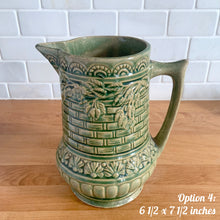 Load image into Gallery viewer, Antique vintage art deco gloss green Rosella 320 ceramic yellow ware pitcher featuring climbing roses on a basketweave pattern. Crafted by Robinson Clay Product Company, the precursor to Robinson Ransbottom Pottery, USA, early 1900s. A beautiful piece to add to your art pottery collection! Option 4, 6 1/2 x 7 1/2 inches
In excellent vintage condition, no chips/cracks/repairs, age-related crazing. Typical manufacturing glaze pops. Unmarked.
