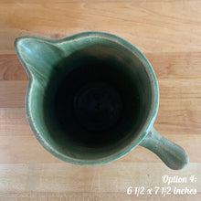 Load image into Gallery viewer, Antique vintage art deco gloss green Rosella 320 ceramic yellow ware pitcher featuring climbing roses on a basketweave pattern. Crafted by Robinson Clay Product Company, the precursor to Robinson Ransbottom Pottery, USA, early 1900s. A beautiful piece to add to your art pottery collection! Option 4, 6 1/2 x 7 1/2 inches
In excellent vintage condition, no chips/cracks/repairs, age-related crazing. Typical manufacturing glaze pops. Unmarked.
