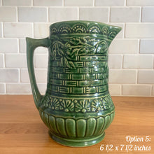 Load image into Gallery viewer, Antique vintage art deco gloss green Rosella 320 ceramic yellow ware pitcher featuring climbing roses on a basketweave pattern. Crafted by Robinson Clay Product Company, the precursor to Robinson Ransbottom Pottery, USA, early 1900s. A beautiful piece to add to your art pottery collection! Option 5, 6 1/2 x 7 1/2 inches
In as found vintage condition, no cracks/repairs, chips to handle, age-related crazing and large manufacturing glaze pops. Maker&#39;s marks.

