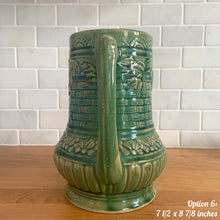 Load image into Gallery viewer, Antique vintage art deco gloss green Rosella 320 ceramic yellow ware pitcher featuring climbing roses on a basketweave pattern. Crafted by Robinson Clay Product Company, the precursor to Robinson Ransbottom Pottery, USA, early 1900s. A beautiful piece to add to your art pottery collection! Option 6, 7 1/2 x 8 7/8 inches. In excellent vintage condition, no chips/cracks/repairs, age-related crazing. Typical manufacturing glaze pops. Unmarked.
