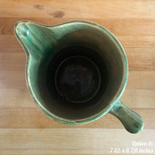 Load image into Gallery viewer, Antique vintage art deco gloss green Rosella 320 ceramic yellow ware pitcher featuring climbing roses on a basketweave pattern. Crafted by Robinson Clay Product Company, the precursor to Robinson Ransbottom Pottery, USA, early 1900s. A beautiful piece to add to your art pottery collection! Option 6, 7 1/2 x 8 7/8 inches. In excellent vintage condition, no chips/cracks/repairs, age-related crazing. Typical manufacturing glaze pops. Unmarked.
