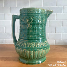 Load image into Gallery viewer, Antique vintage art deco gloss green Rosella 320 ceramic yellow ware pitcher featuring climbing roses on a basketweave pattern. Crafted by Robinson Clay Product Company, the precursor to Robinson Ransbottom Pottery, USA, early 1900s. A beautiful piece to add to your art pottery collection! Option 7, 7 1/2 x 8 7/8 inches. In excellent vintage condition, no chips/cracks/repairs, age-related crazing. Typical manufacturing glaze pops. Unmarked.
