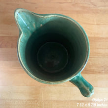 Load image into Gallery viewer, Antique vintage art deco gloss green Rosella 320 ceramic yellow ware pitcher featuring climbing roses on a basketweave pattern. Crafted by Robinson Clay Product Company, the precursor to Robinson Ransbottom Pottery, USA, early 1900s. A beautiful piece to add to your art pottery collection! Option 7, 7 1/2 x 8 7/8 inches. In excellent vintage condition, no chips/cracks/repairs, age-related crazing. Typical manufacturing glaze pops. Unmarked.
