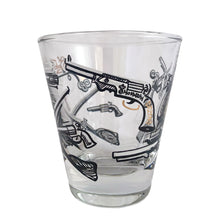 Load image into Gallery viewer, Set of six vintage wild west themed double shot glasses featuring revolvers and pistols in black, white and gold. Crafted by Libbey Glass, circa 1950s. A great addition to your barware collection!
In excellent condition, no chips. Marked on the bottom with the Libbey L.

Measures 2 3/4 x 3 inches

Capacity 2 ounces
