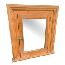 Load image into Gallery viewer, This early 20th-century rustic medicine cabinet exemplifies the craftsmanship of Toronto&#39;s heritage homes. Salvaged from a period residence, it features solid wood construction paired with an original mirrored door—a hallmark of vintage bathroom fixtures. The cabinet&#39;s authentic patina and period-appropriate brass hardware reflect decades of domestic use, making it a distinctive accent for collectors and design enthusiasts seeking genuine antique character. Ideal for display or functional storage. 
