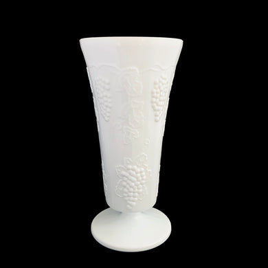 Vintage milk glass Harvest trumpet shaped, footed vase features a pressed grape and leaf pattern. Crafted by Colony Glass, circa 1960s. A wonderful addition to farmhouse, cottage and wedding decor.

In excellent condition, no chips or cracks.

Measures 4 7/8 x 9 7/8 inches