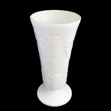 Load image into Gallery viewer, Vintage milk glass Harvest trumpet shaped, footed vase features a pressed grape and leaf pattern. Crafted by Colony Glass, circa 1960s. A wonderful addition to farmhouse, cottage and wedding decor.

In excellent condition, no chips or cracks.

Measures 4 7/8 x 9 7/8 inches

