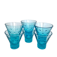 Load image into Gallery viewer, Six Hazel-Atlas Capri Dots turquoise whisky glasses grouped together, front-facing view showing the flared rim, embossed dots, and stepped turquoise base and stackable characteristic


