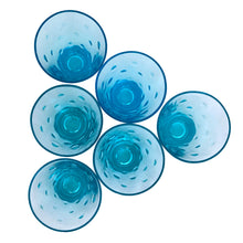 Load image into Gallery viewer, Overhead view of all 6 Hazel-Atlas Capri Dots turquoise whisky glasses arranged in a cluster, showing the interior bowl and embossed dot pattern and rim
