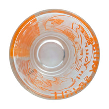 Load image into Gallery viewer, Vintage Here&#39;s Mud in Your Eye novelty bar measure featuring a clumsy fisherman and 1, 2, 3 and 4 ounce levels printed in orange on clear glass. Maker unknown, 1970s.

In as found vintage condition, no chips, some wear to inside bottom.

Measures 2 1/4 x 3 inches
