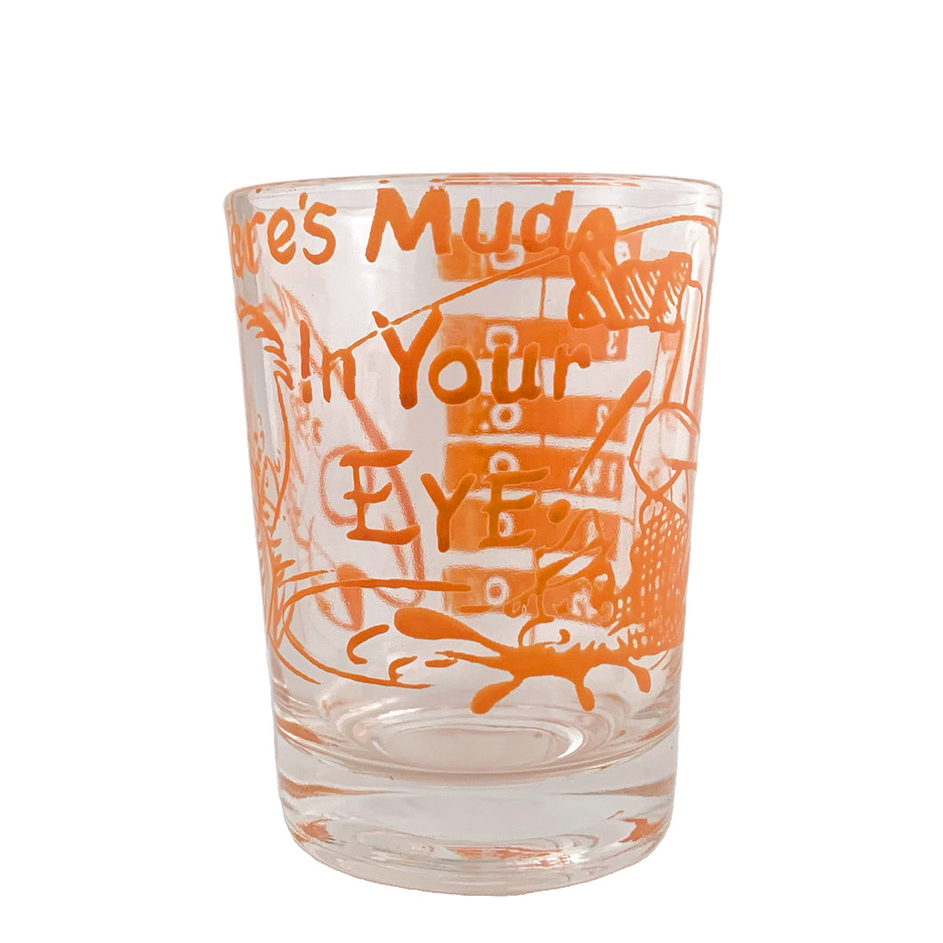 Vintage Here's Mud in Your Eye novelty bar measure featuring a clumsy fisherman and 1, 2, 3 and 4 ounce levels printed in orange on clear glass. Maker unknown, 1970s.

In as found vintage condition, no chips, some wear to inside bottom.

Measures 2 1/4 x 3 inches