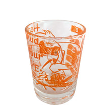 Load image into Gallery viewer, Vintage Here&#39;s Mud in Your Eye novelty bar measure featuring a clumsy fisherman and 1, 2, 3 and 4 ounce levels printed in orange on clear glass. Maker unknown, 1970s.

In as found vintage condition, no chips, some wear to inside bottom.

Measures 2 1/4 x 3 inches
