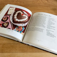 Load image into Gallery viewer, This fabulous vintage hardcover cookbook features decadent cake recipes straight from the makers of Hershey&#39;s chocolate, one of the world&#39;s most recognizable brands! Its 122 pages are filled with amazing recipes along with many colour photographs. All recipes developed by Marjorie Anderson and tested in the Hershey Kitchens. Published by Joshua Morris Publishing, 1992.   In great  condition!   
