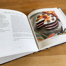 Load image into Gallery viewer, This fabulous vintage hardcover cookbook features decadent cake recipes straight from the makers of Hershey&#39;s chocolate, one of the world&#39;s most recognizable brands! Its 122 pages are filled with amazing recipes along with many colour photographs. All recipes developed by Marjorie Anderson and tested in the Hershey Kitchens. Published by Joshua Morris Publishing, 1992.   In great  condition!   
