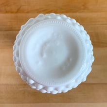 Load image into Gallery viewer, Classic vintage hobnail milk glass floral bud vase. Crafted by EO Brody, USA, circa 1950s. Create a elegant flower arrangement with this pretty vase. Suits farmhouse, shabby chic, cottage core, plus wedding or bridal decor.

In excellent condition, free from chips.

Measures 3 1/4 x 7 1/2 inches
