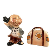 Load image into Gallery viewer, Rare vintage hand painted hobo tipping his top hat and suitcase ceramic salt and pepper shakers with corks. Enesco, Japan, 1950s. Add these unique shakers to your collection!

In excellent vintage condition, no chips/cracks/repairs. Original stickers.

Hobo measures 2 1/4 x 1 5/8 x 3 1/4 inches, suitcase measures 2 1/2 x 1 1/4 x 2 inches
