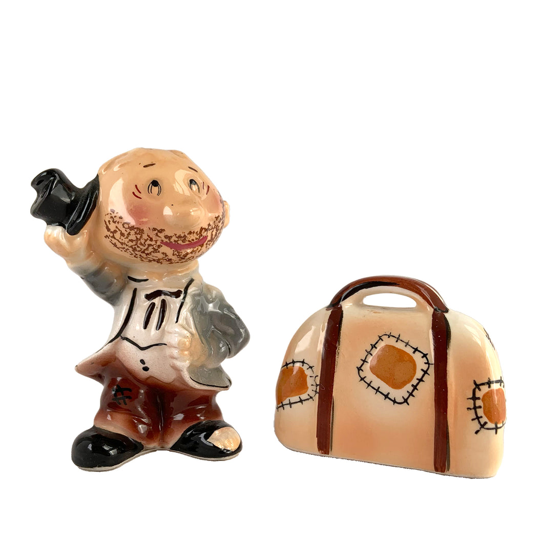 Rare vintage hand painted hobo tipping his top hat and suitcase ceramic salt and pepper shakers with corks. Enesco, Japan, 1950s. Add these unique shakers to your collection!

In excellent vintage condition, no chips/cracks/repairs. Original stickers.

Hobo measures 2 1/4 x 1 5/8 x 3 1/4 inches, suitcase measures 2 1/2 x 1 1/4 x 2 inches